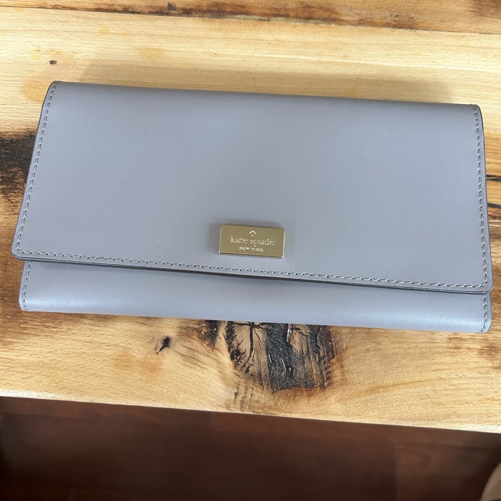 Kate Spade Gray Wallet with Pebbled Finish and Flap Closure